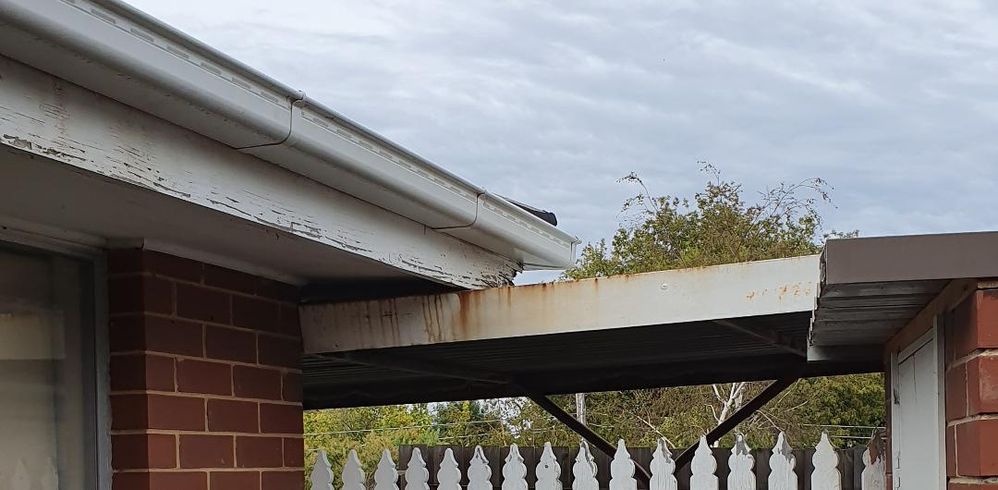 You can see what they did to the fascia board between the gutter and the carport roof